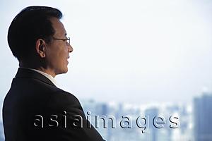Asia Images Group - Profile of man wearing glasses looking out the window