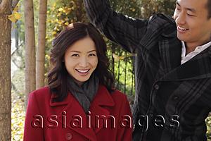 Asia Images Group - Young couple smiling together oudoors