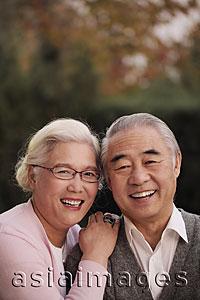 Asia Images Group - Head shot of older couple smiling together
