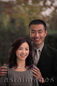 Asia Images Group - Young couple dressed up and smiling