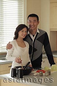 Asia Images Group - Young couple cooking together in the kitchen