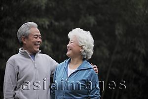Asia Images Group - A senior couple looking at each other smiling