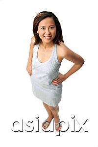 AsiaPix - Woman with hands on hips, looking up at camera
