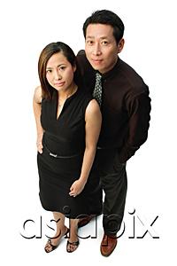 AsiaPix - Couple standing, looking at camera, portrait