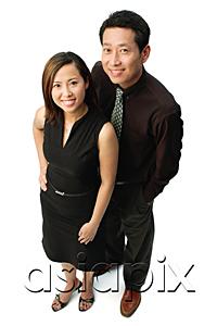 AsiaPix - Couple standing, looking at camera, smiling