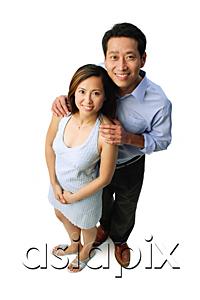 AsiaPix - Couple standing side by side, smiling at camera