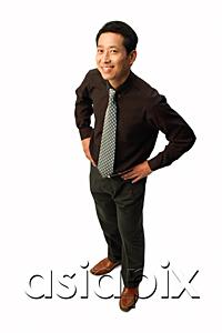 AsiaPix - Man standing with hands on hips, smiling at camera