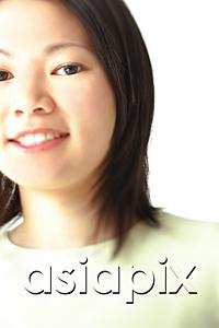 AsiaPix - Young woman, smiling at camera, head shot, portrait