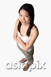 AsiaPix - Young woman looking at camera, arms crossed