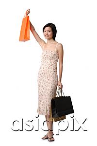 AsiaPix - Young woman with shopping bags, portrait