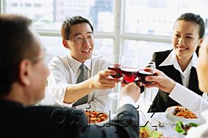 AsiaPix - Executives at restaurant, toasting with wine