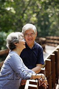 AsiaPix - Mature couple side by side, smiling, woman looking up