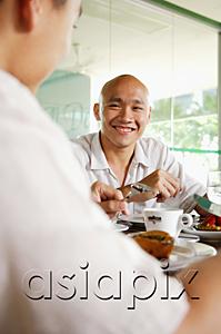 AsiaPix - Two men at a cafe, over the shoulder view