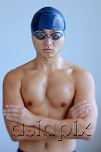 AsiaPix - Man wearing swimming cap and goggles, arms crossed, looking at camera
