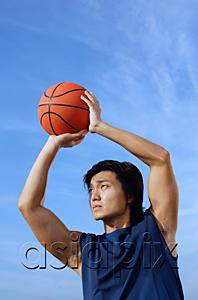 AsiaPix - Man aiming basketball