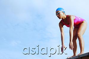 AsiaPix - Woman in swimming costume, bending over, preparing to dive