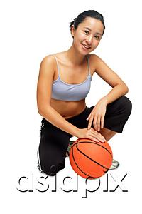 AsiaPix - Woman crouching on floor, hand on basketball