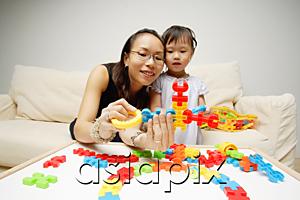 AsiaPix - Mother and daughter looking at toy pieces