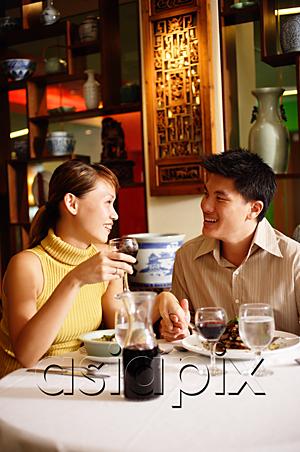 AsiaPix - Couple dining in Chinese restaurant