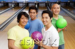 AsiaPix - Four men in bowling alley, holding bowling balls