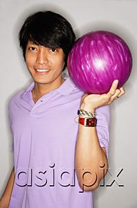 AsiaPix - Man carrying bowling ball, smiling at camera