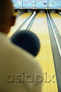 AsiaPix - Man bowling, over the shoulder view