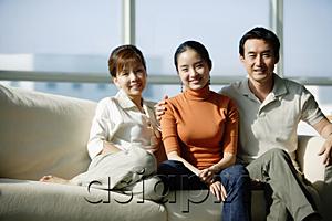 AsiaPix - Family with one daughter sitting on sofa