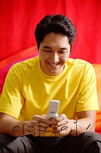 AsiaPix - Man using mobile phone, smiling