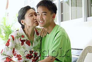 AsiaPix - Grandmother giving grandson a kiss on the cheek
