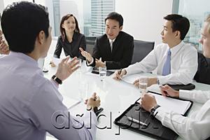 AsiaPix - Executives having a discussion around conference table