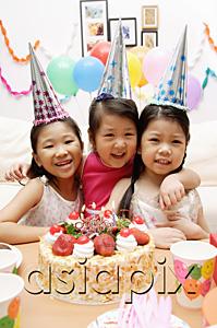 AsiaPix - Three girls celebrating a birthday, smiling at camera