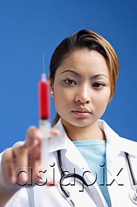 AsiaPix - Female doctor holding syringe