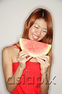AsiaPix - Woman holding a slice of watermelon