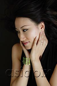 AsiaPix - Woman with hands on face, looking away