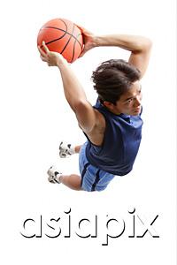 AsiaPix - Young man holding basketball, jumping, preparing to shoot