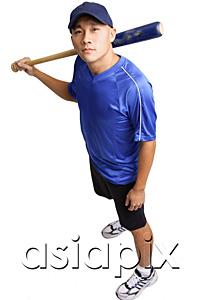 AsiaPix - Young man holding baseball bat, looking up at camera