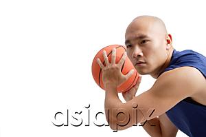 AsiaPix - Young man playing basketball