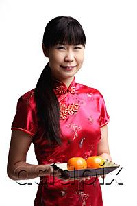 AsiaPix - Woman in Cheongsam, holding plate with two oranges