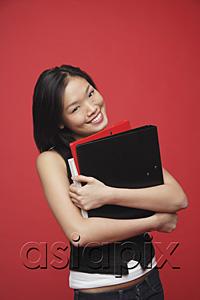 AsiaPix - Woman carrying books, portrait