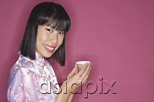 AsiaPix - Woman holding Chinese tea cup