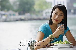 AsiaPix - Young woman in cafe, looking away