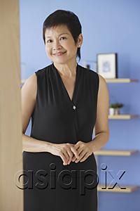 AsiaPix - Mature woman in black dress, smiling at camera