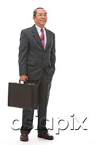 AsiaPix - Businessman standing with briefcase