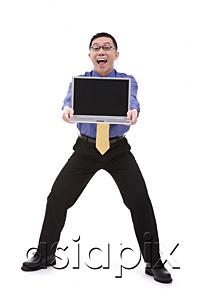 AsiaPix - Businessman carrying laptop, portrait