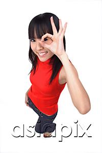AsiaPix - Young woman making Ok sign with fingers