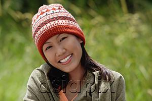 AsiaPix - Woman with ski cap, wrapped in a blanket, portrait