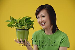 AsiaPix - Young Woman looking at camera, sideview