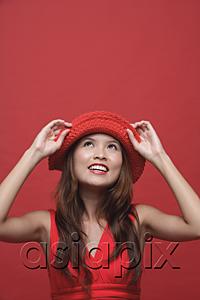 AsiaPix - Woman with red hat, smiling