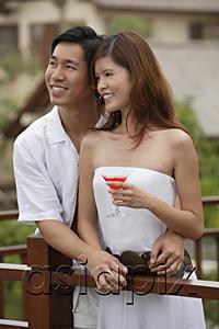 AsiaPix - Couple standing side by side on balcony, smiling