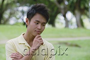 AsiaPix - Young man with hand on chin